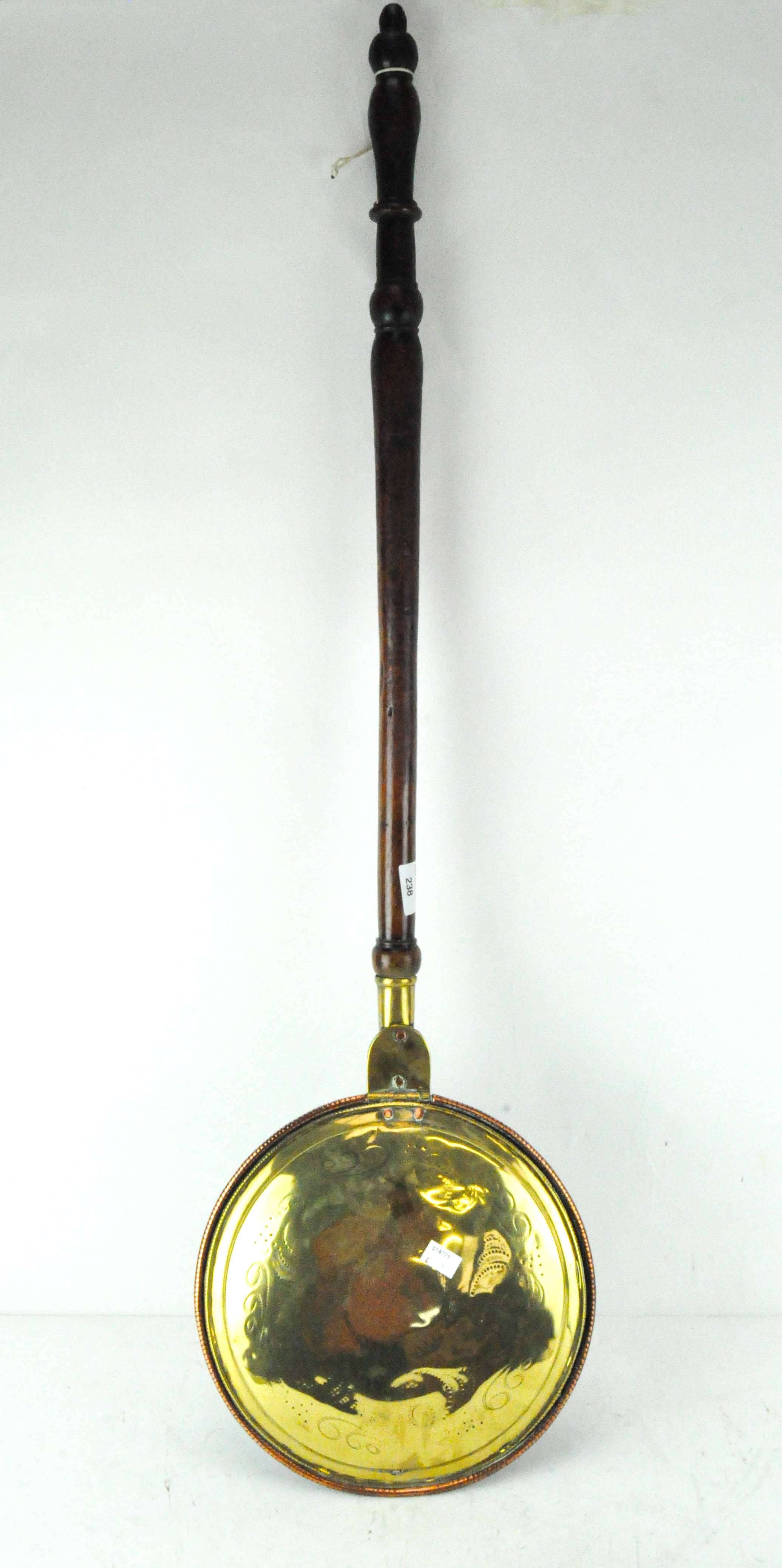 A late 19th century copper warming pan, with mahogany handle,