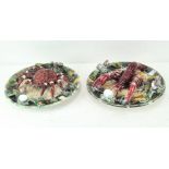 A pair of Portuguese majolica Palissy style dishes, one decorated with a crab,
