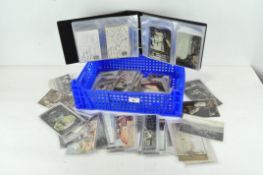A large quantity of 20th century used postcards, featuring buildings, traditional figures and more