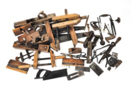 A large selection of assorted vintage tools including saws, clamps, planes,