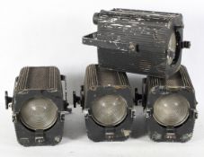 Four vintage spotlights, in black painted metal frames with handles to the top,