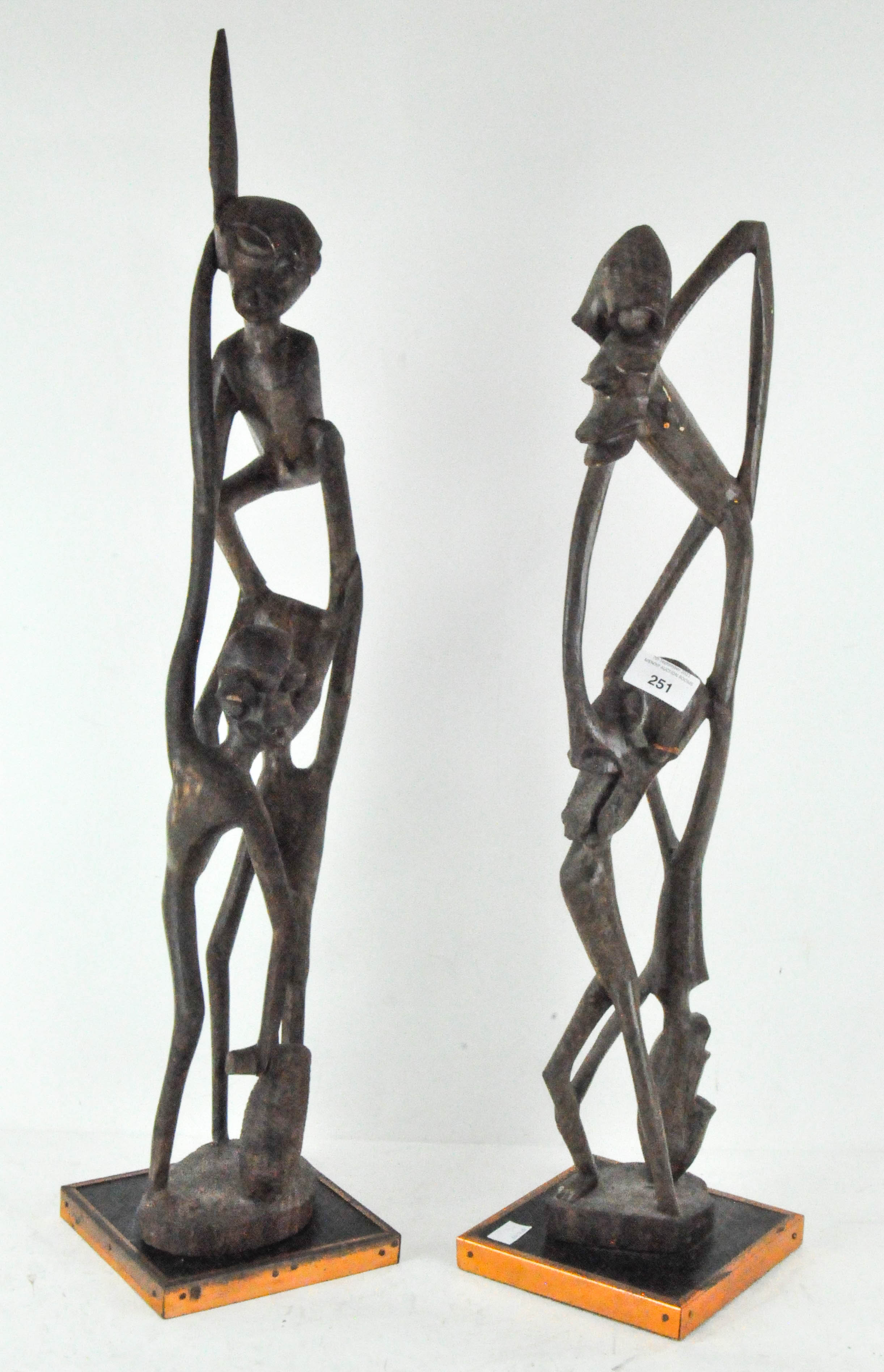 Two wooden African figure groups,