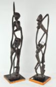 Two wooden African figure groups,