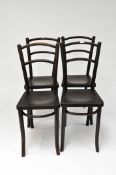 A set of four 'Thonet' Art Nouveau style wooden chairs with bentwood cross rails