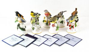 Nine Franklin Mint bisque bells designed by Peter Barrett, all depicting various birds,