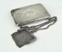 An early 20th century silver evening purse, and a mesh coin purse,