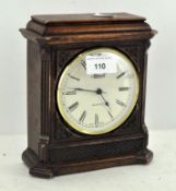 A vintage Hermle quartz mantle clock, the dial with Roman numerals denoting hours,