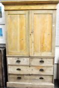A Victorian pine linen press, the two door cupboard opening to reveal shelved interior,