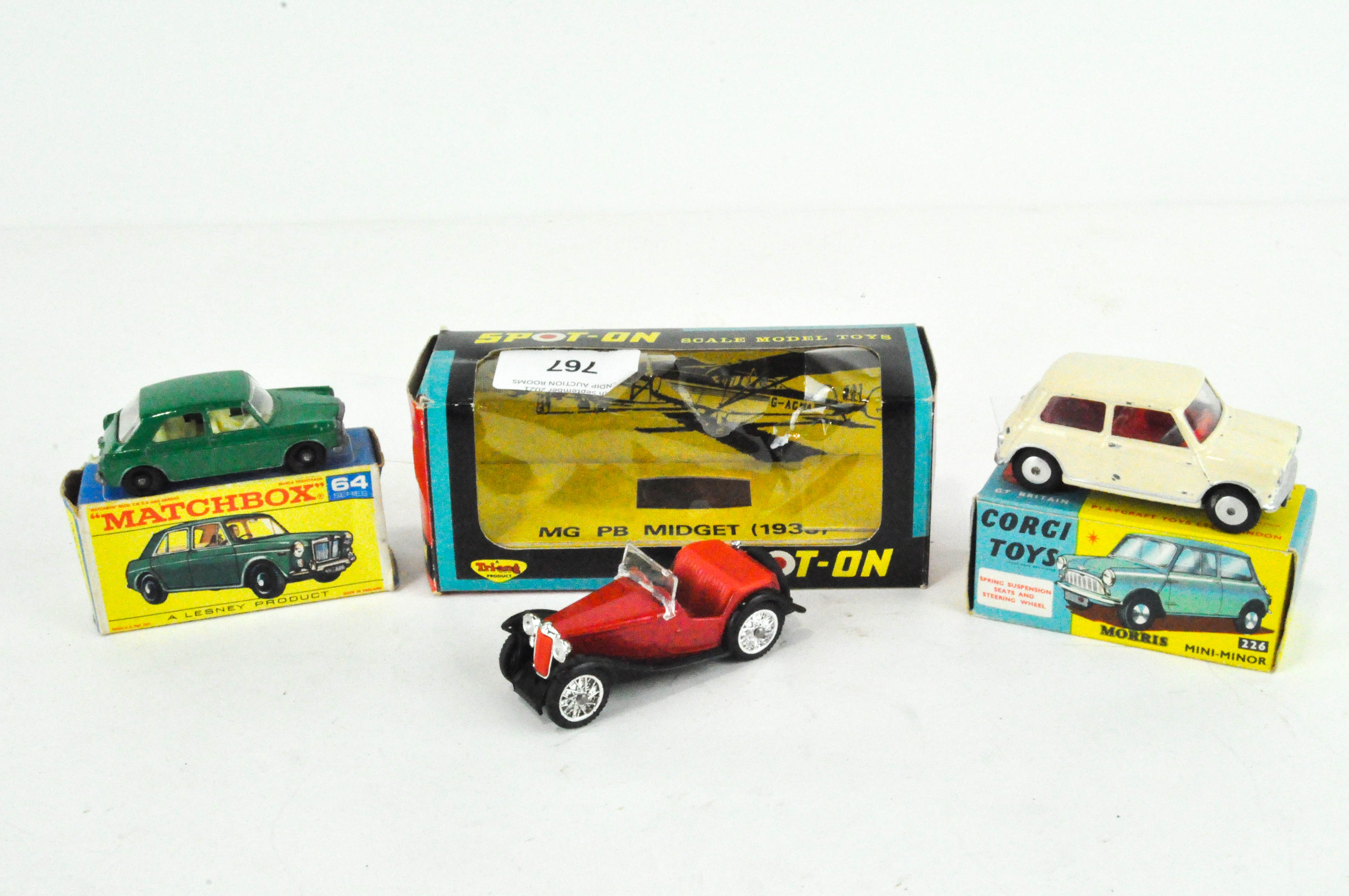 A Matchbox M.G. 1100, Corgi Morris Mini-Minor, Corgi and a Tri-ang Spot-on no. 279 MG PB Midget