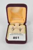 A pair of white metal diamond set stud earrings, each clasp stamped 750