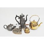 A selection of vintage pewter and brass teapots and kettles and an iron,