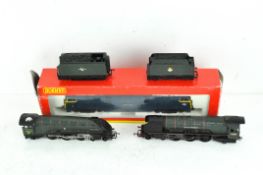 A boxed OO gauge Hornby locomotive together with two unboxed locomotives