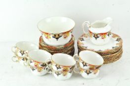 A part Aynsley tea set including cups, saucers, plates, a jug and a bowl,