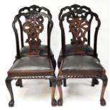 Four 20th century stained wood dining chairs with ornate back with a central knot motif,