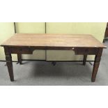 A large modern stained wooden desk, the rectangular top with metal handled drawers either side,