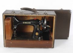 A Singer 99k hand cranked sewing machine, EK15377, in black with gilt embellishments,