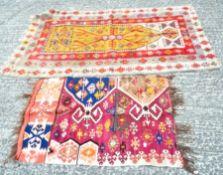 Two colourful Pakistani rugs,