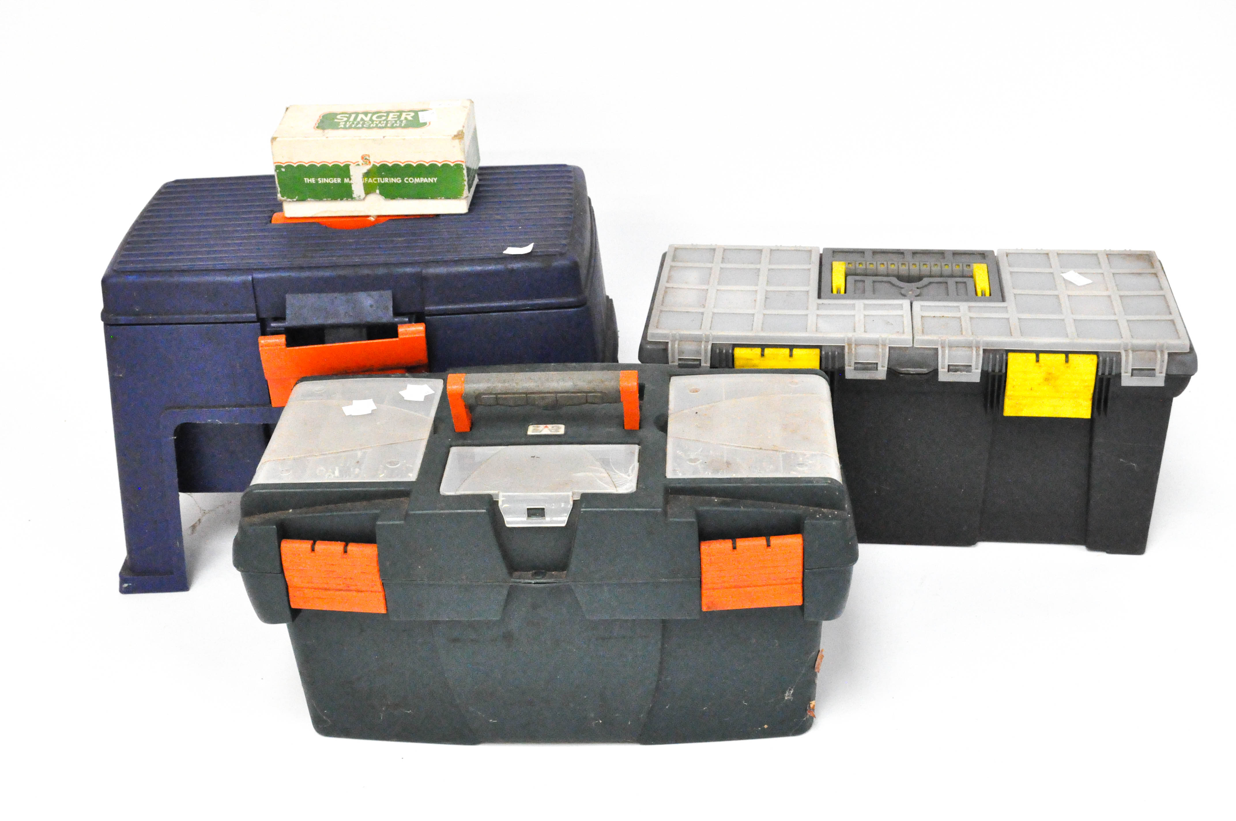 Three large plastic tool boxes and tools, including drill bits, screws,