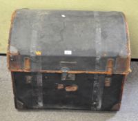 An early 20th century black painted dome top trunk,