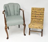 Two early 20th century chairs, one being shell shaped, both with floral upholstery,