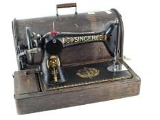 A vintage Singer sewing machine, numbered F7970576,