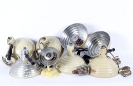 A box of infrared lamps, predominately Pifco, enamelled in buff tones with wooden handles,