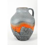 A West German pottery jug, with raised decoration,
