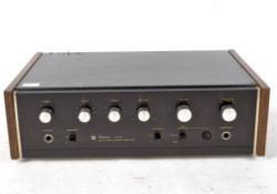 A Sansui Au-101 Solid State Stereo Amplifier, in part wooden veneered case,