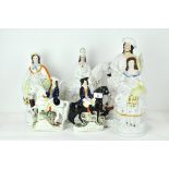 Six Staffordshire pottery figures, including Dick Turpin and Tom King,