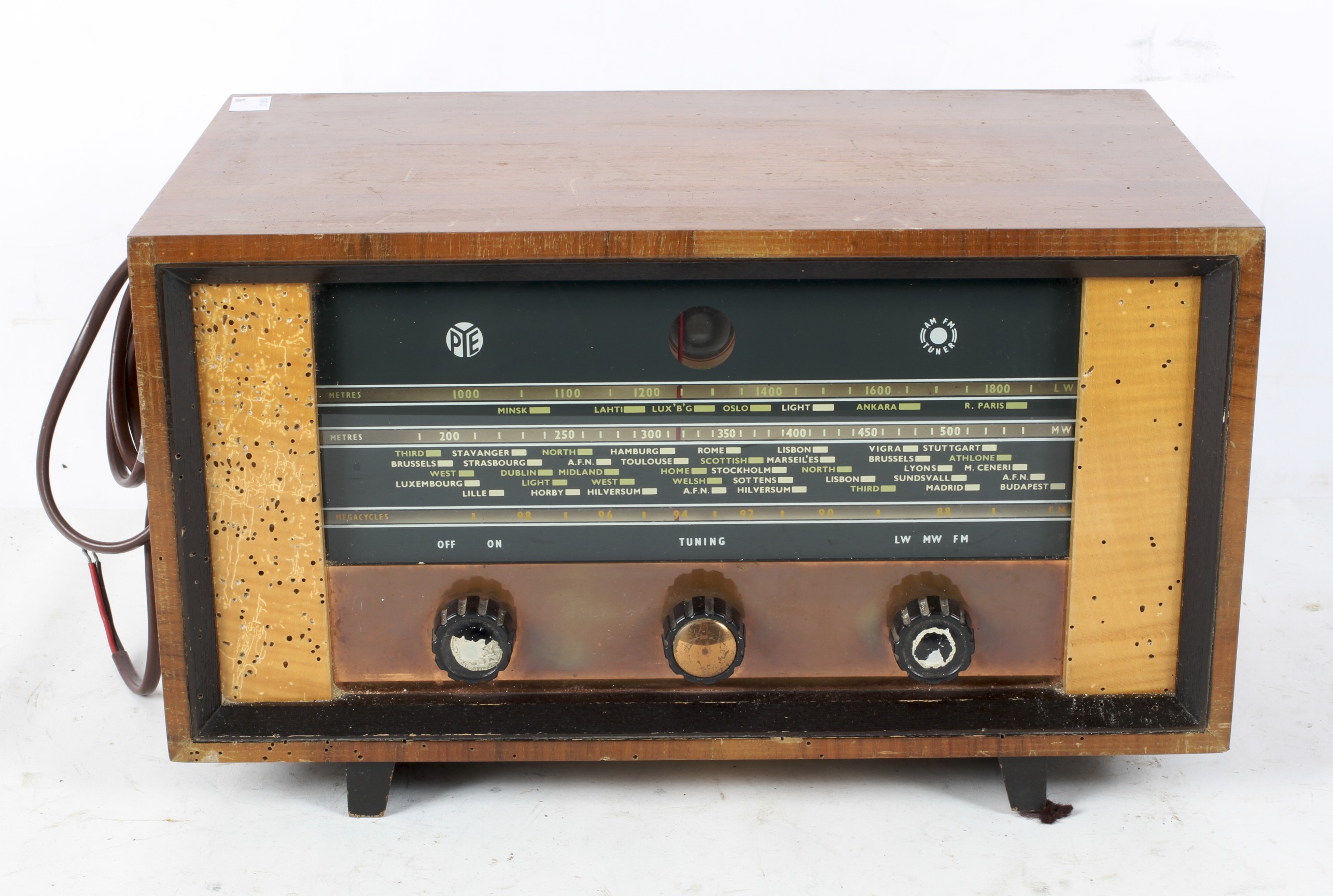 A Cambridge PYE AM/FM tuner, type htf111, within a wooden case on raised feet,