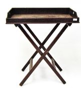 A late 19th/ early 20th century large butlers tray on folding stand,