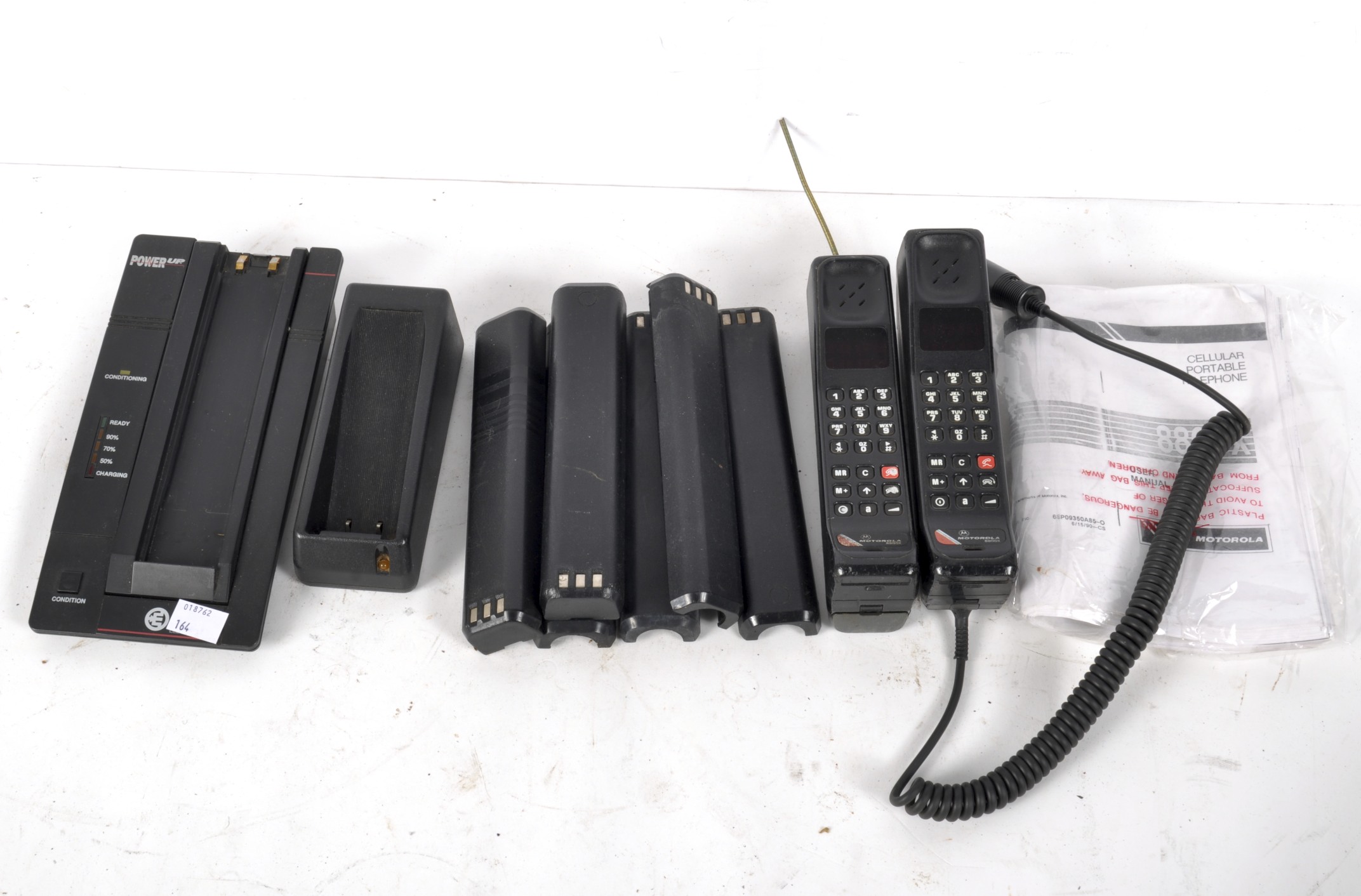 A collection of Motorola 8800X cellular portable telephones,