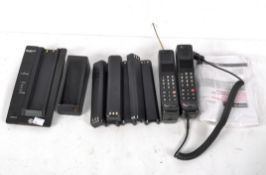A collection of Motorola 8800X cellular portable telephones,