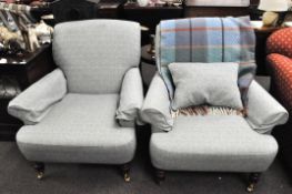 A pair of contemporary Multiyork armchairs upholstered in blue and white,