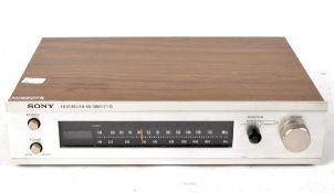 A 1970's Retro Sony Stereo FM/AM tuner ST-73, in part wooden veneered case,