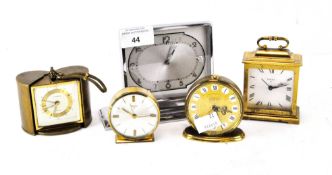 A vintage retro travel alarm clock by Europa, with a brass and ebonised chapter ring,