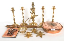 A collection of assorted metalware, including a set of four brass candlesticks,