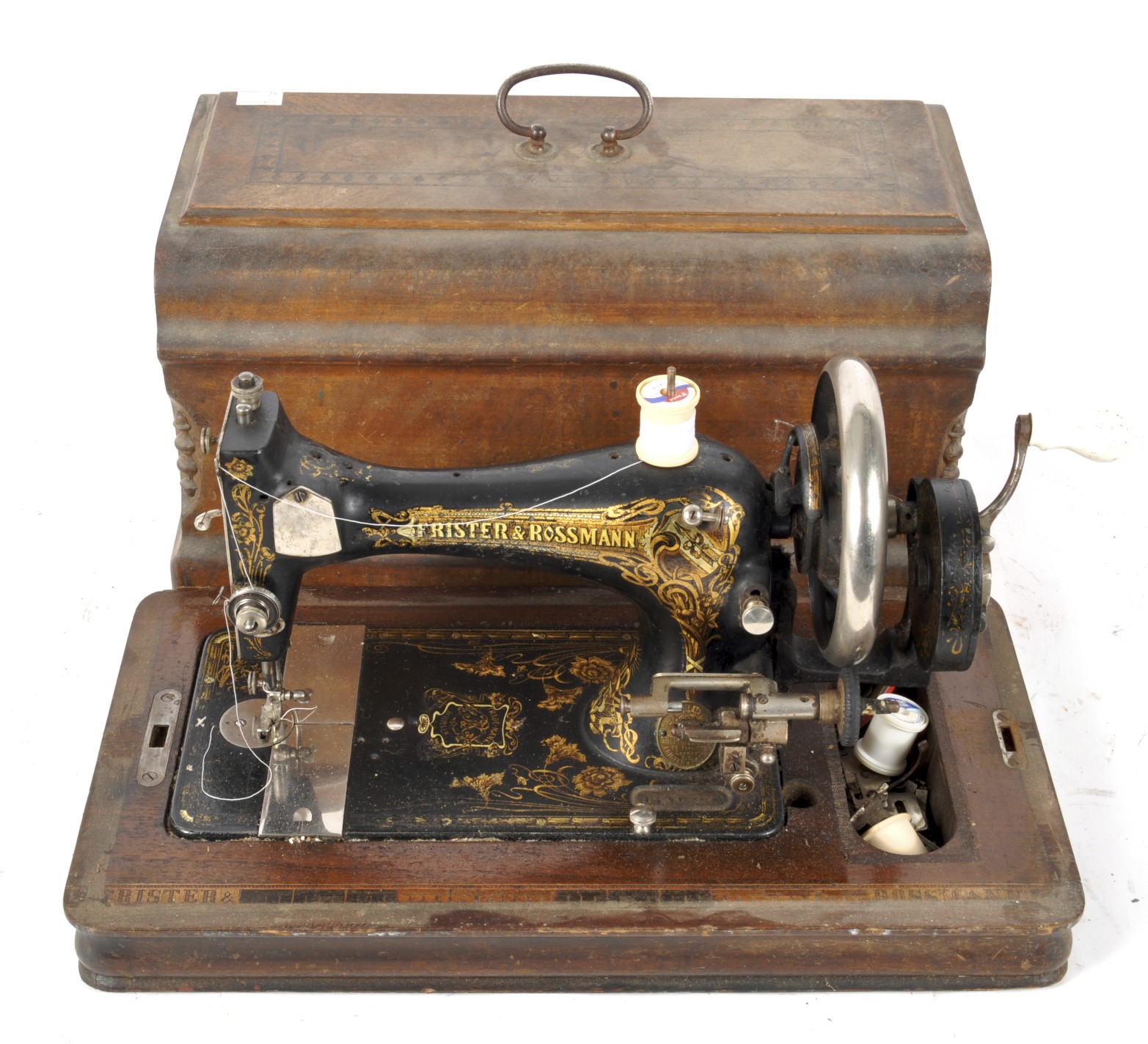 An antique Frister & Rossmann hand crank sewing machine,