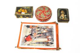 A box of vintage jigsaw puzzles and three vintage biscuit tins