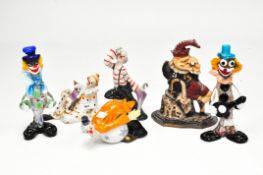 A collection of clowns including two Murano glass figures, a door stop and three ceramic figures