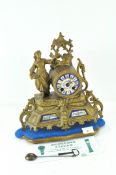 A late 19th-early 20th Century French mantle clock, the enamelled dial with Roman numerals,