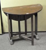 An early 20th century small oval oak gate leg side table,