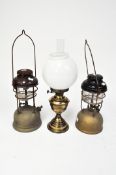An early 20th century Duplex oil lamp together with two hanging lanterns