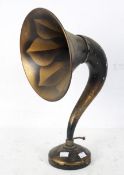 A retro horn speaker, the metal horn and base decorated with leaves, the base impressed XR351,