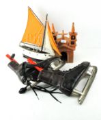 A wooden model boat togther with other items