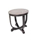 A stained wood Art Deco style occasional table of circular form on bentwood supports