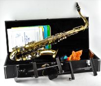 A vintage saxophone in fitted travelling case,