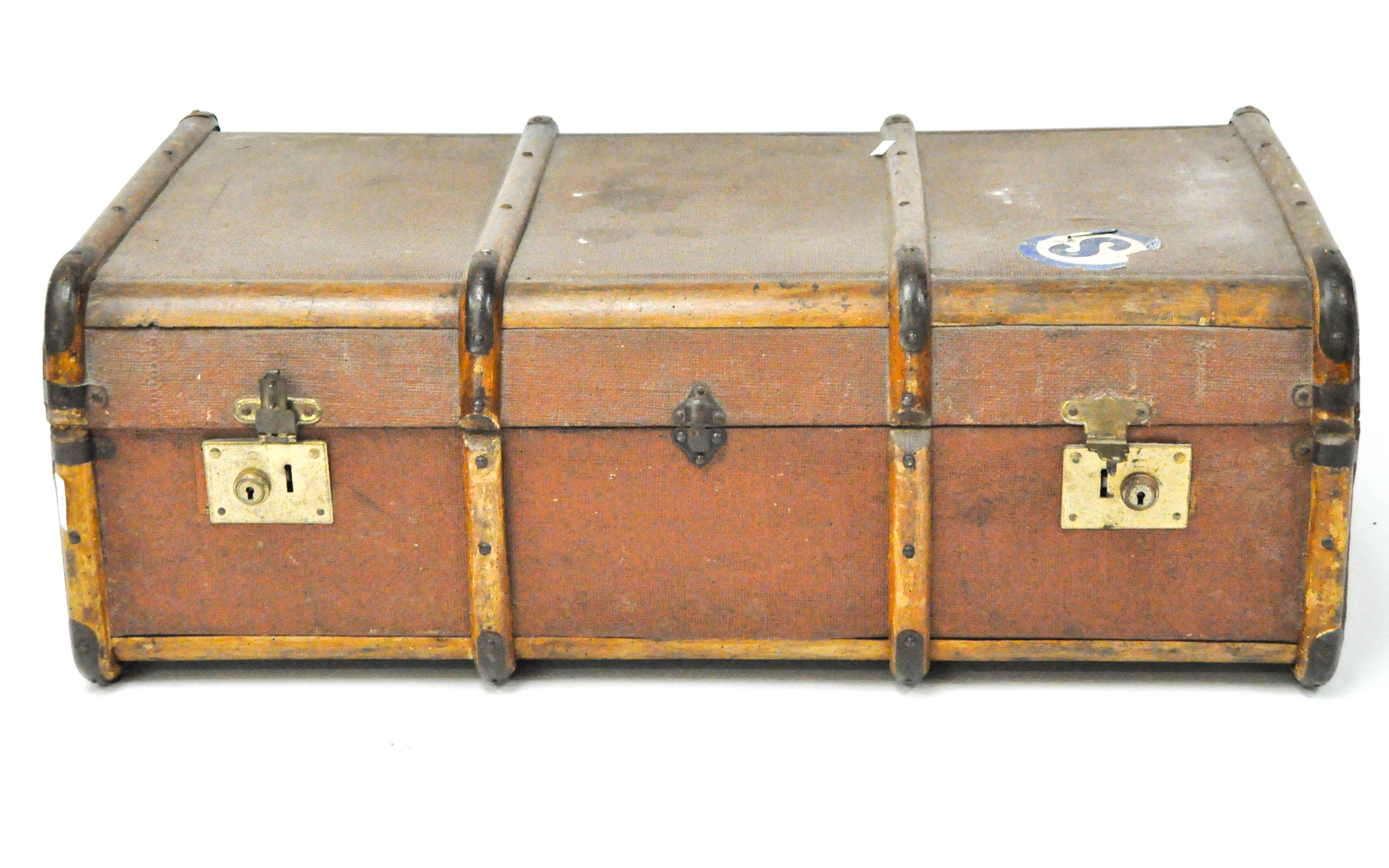 A vintage canvas and wooden bound travelling trunk, locks being stamped "British made",