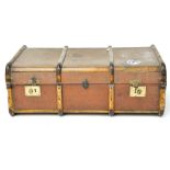 A vintage canvas and wooden bound travelling trunk, locks being stamped "British made",