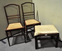 Two early 20th century mahogany inlaid chairs with wicker seats, with upholstered stool